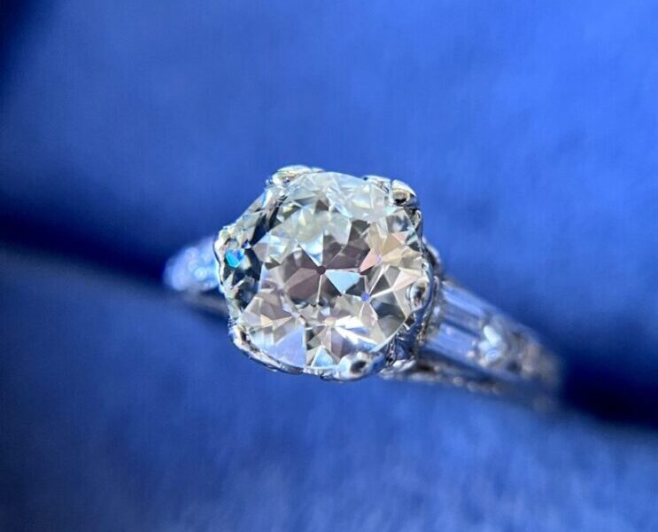 Diamond ring with blue background.
