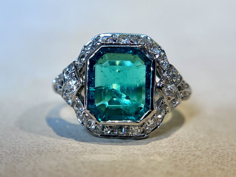 Emerald-cut ring with diamond accents.
