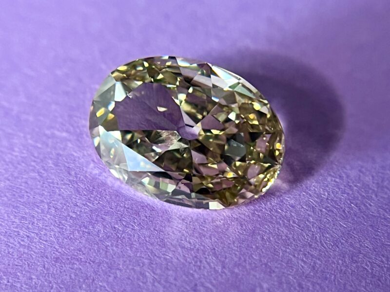 Oval diamond on a purple background.